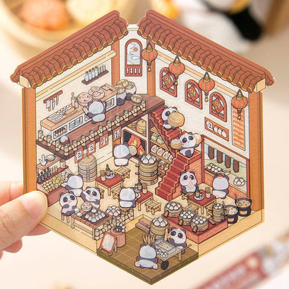 Cute panda scene sticker of a bustling Chinese dim sum shop with steaming baskets and red lanterns